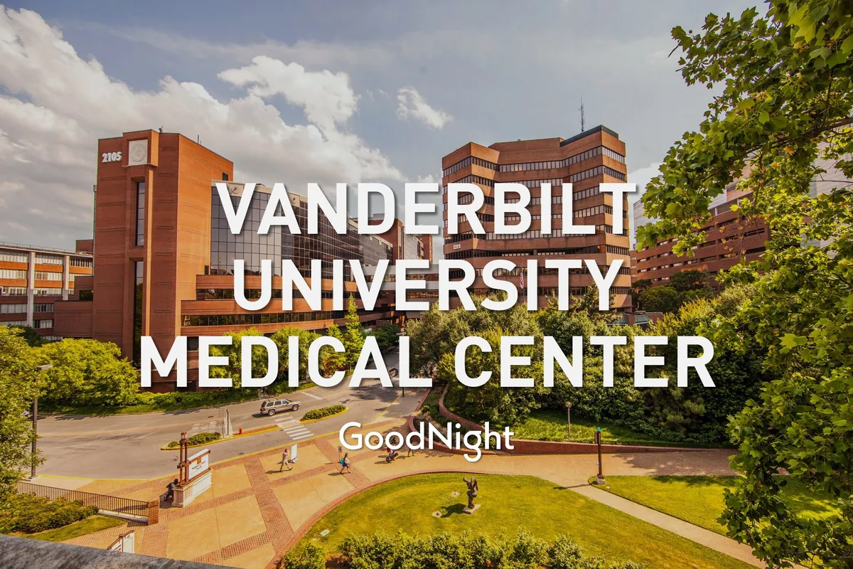 This image features the Vanderbilt University Medical Center building surrounded by greenery, landscaped pathways, and a welcoming, well-maintained exterior. The setting exudes a sense of accessibility and comfort, making it ideal for visitors attending medical appointments or professional engagements.